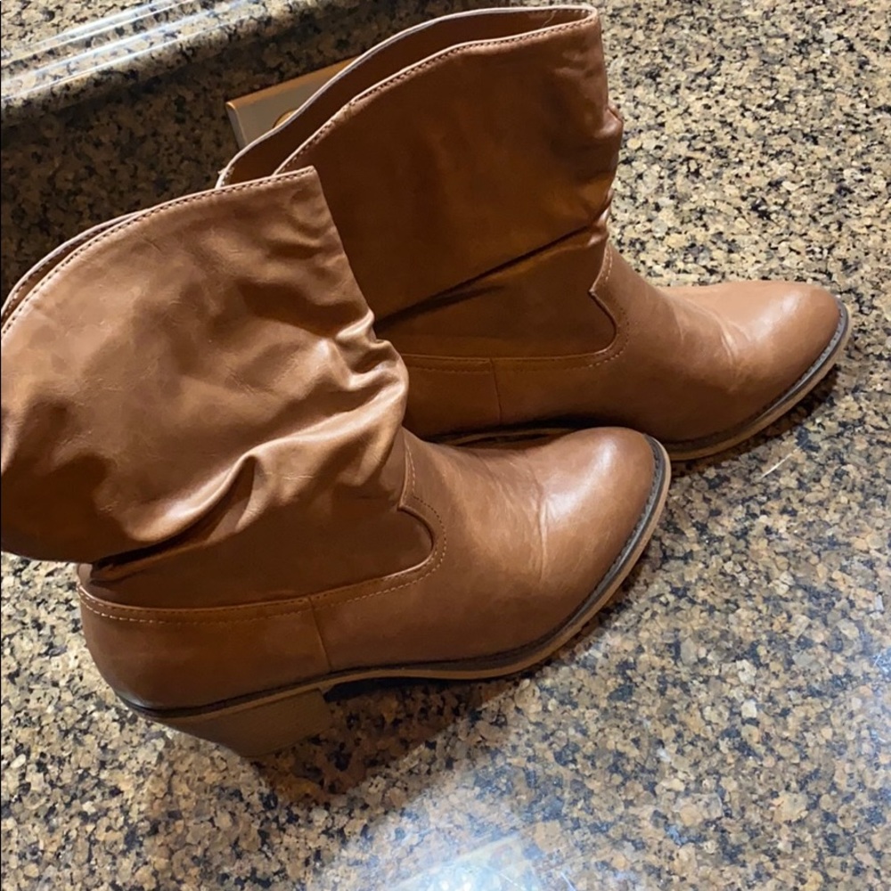 Brown healed cowboy like boots